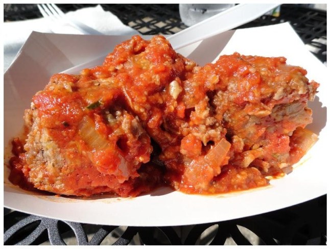 "meatballs" (made with whole grains and seeds) covered in a flavourful tomato sauce with onions