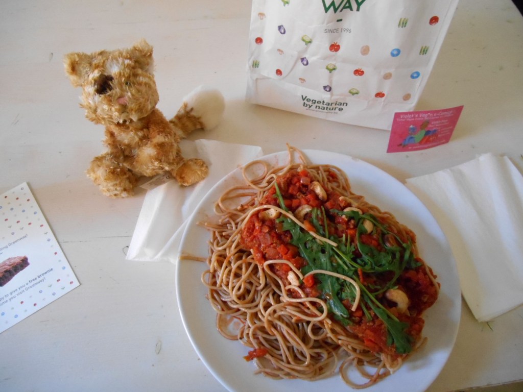 Take away food in paper bag from Greenway vegetarian restaurant.  Vegan Spaghetti bolognese.