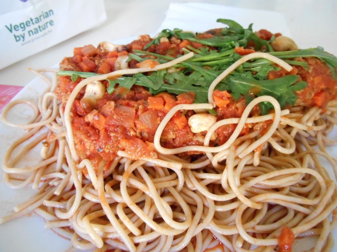 Take away food in paper bag from Greenway vegetarian restaurant.  Vegan Spaghetti bolognese.